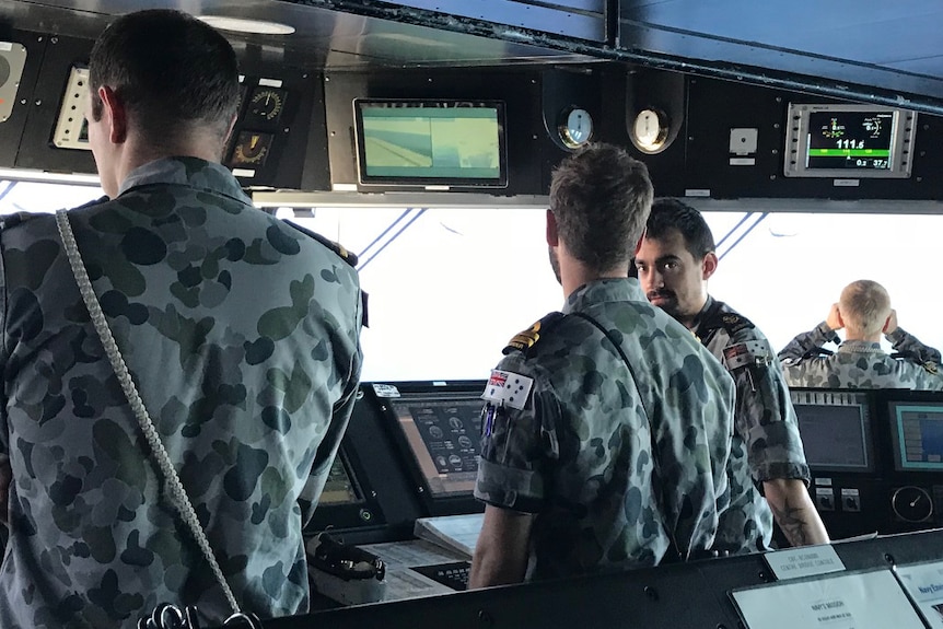Crew on the bridge of HMAS Canberra as part of Exercise Ocean Explorer 2018.