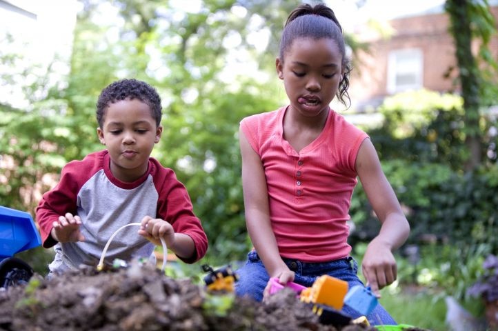 Two kids play in park