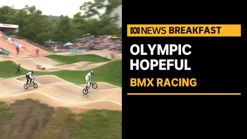 Olympic Hopeful, BMX Racing: Bikes race over a series of small jumps on race track. 