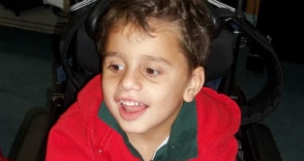 A young boy in a wheelchair.