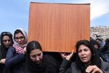 Independent Afghan civil society activist women carry the coffin of Farkhunda, who was lynched by an angry mob in central Kabul