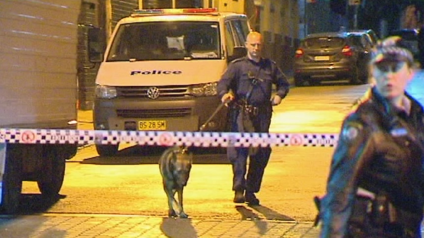 Police investigate the stabbing of a 64-year-old man in Redfern.