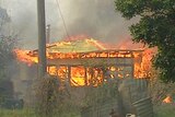 Mopping up: The fires yesterday destroyed seven houses.