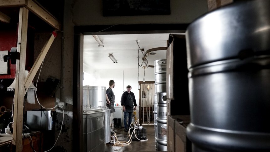 Owner of Robe Town Brewery chats with cellar door operator Brenton Lynch-Rhodes in the brewery