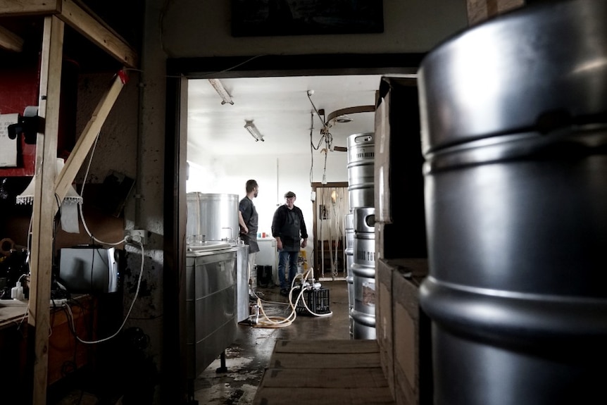 Owner of Robe Town Brewery chats with cellar door operator Brenton Lynch-Rhodes in the brewery