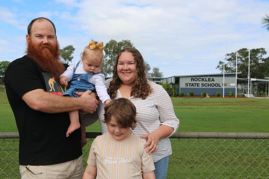Rocklea State School family Ned Gulliford, Lily, Milton, who is in year one, and baby Magnolia at flood-affected campus
