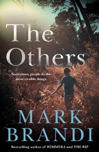 A book cover featuring a boy walking through bushland with trees looming overhead and dappled light