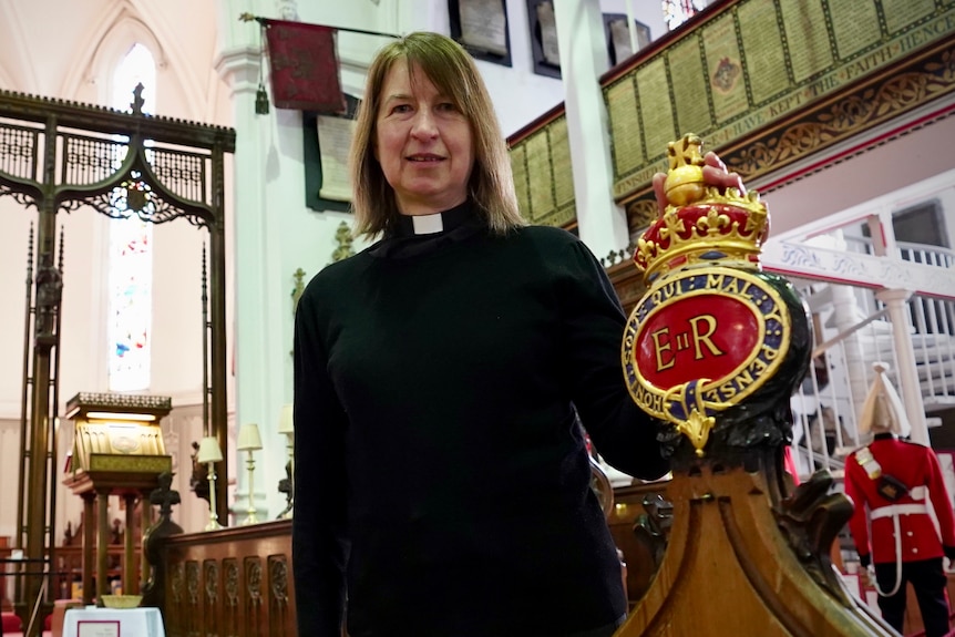 A female reverend in a church in Windsor.