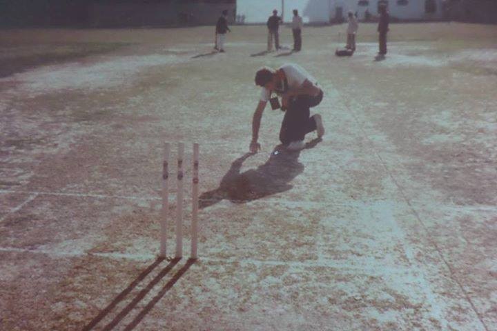 An old photo of a cricket pitch.