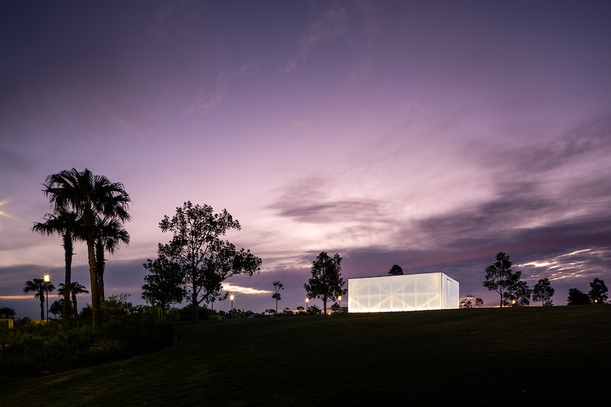 Colour photograph of architect-design pavilion Blak Box at night time on Stargazer's Lawn at Barangaroo Reserve