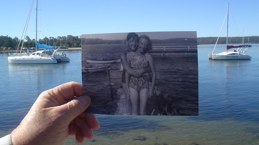 Foreground: Black and white photo of a couple standing at a pool. Background: The Clyde River Batemans Bay