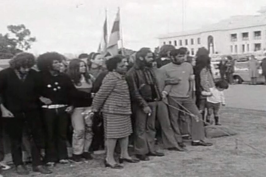 A black and white photo of protestors outside Old Parliament House.