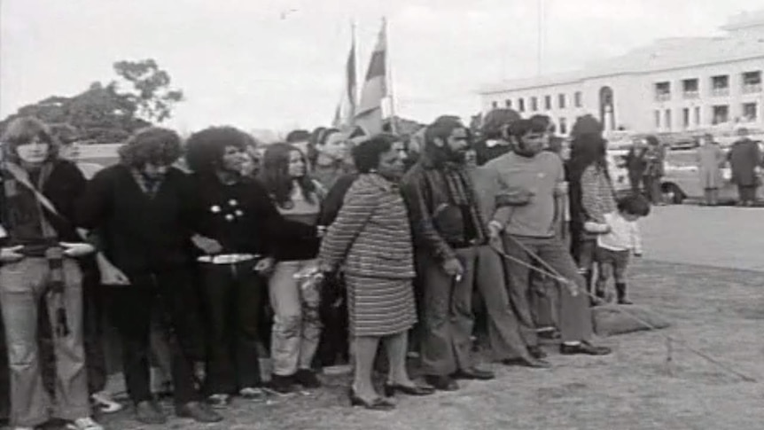 A black and white photo of protestors outside Old Parliament House.