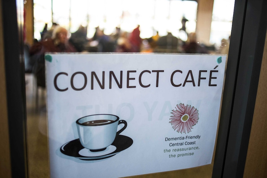 Dementia cafe sign on a door