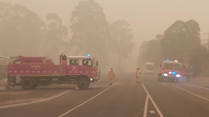 Two firetrucks on a highway at Cann River.