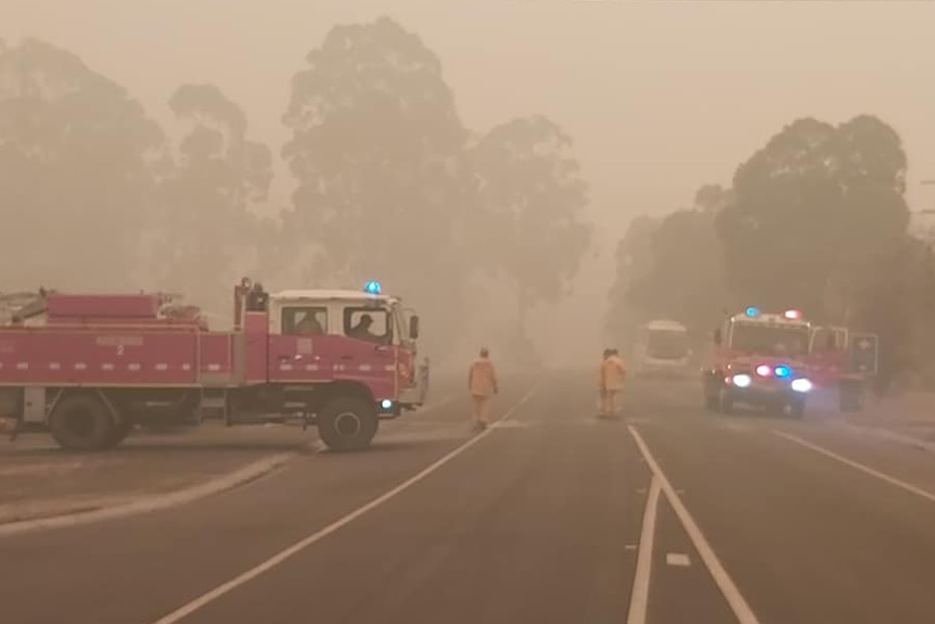 Two firetrucks on a highway at Cann River.