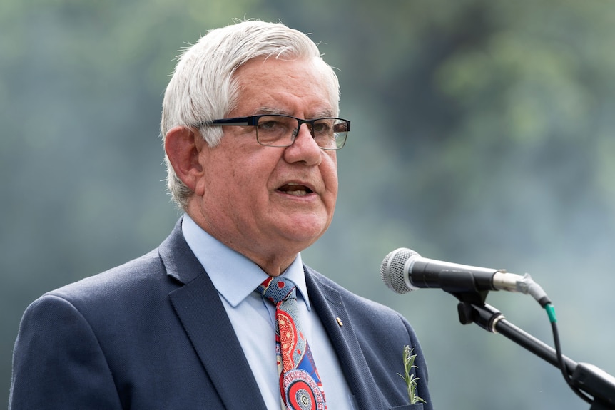 Headshot of Ken Wyatt at a microphone