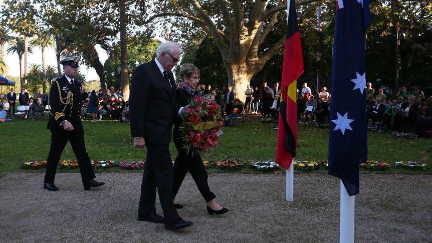 laying of wreaths, Australian flag, Aboriginal flag, outdoors on lawn