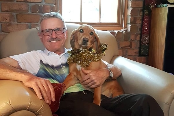 Boating victim Alan Bottrill holding a dog.