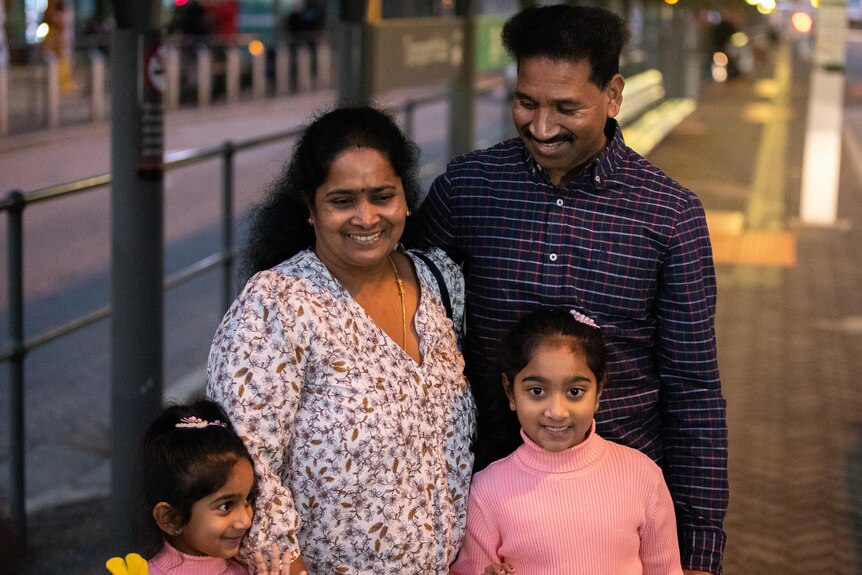 The Nadesalingam family stand together for a photo at Perth Airport.