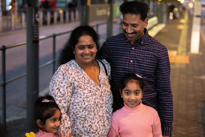 The Nadesalingam family stand together for a photo at Perth Airport.