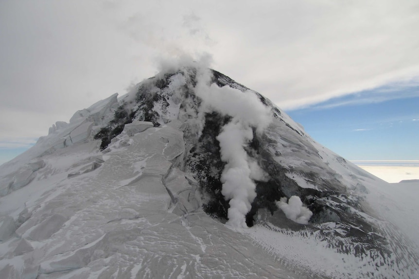 An aerial view of steam rising from a volcanic vent on Big Ben, Heard Island