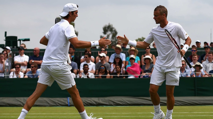 Lleyton Hewitt congratulates Thanasi Kokkinakis in Wimbledon doubles