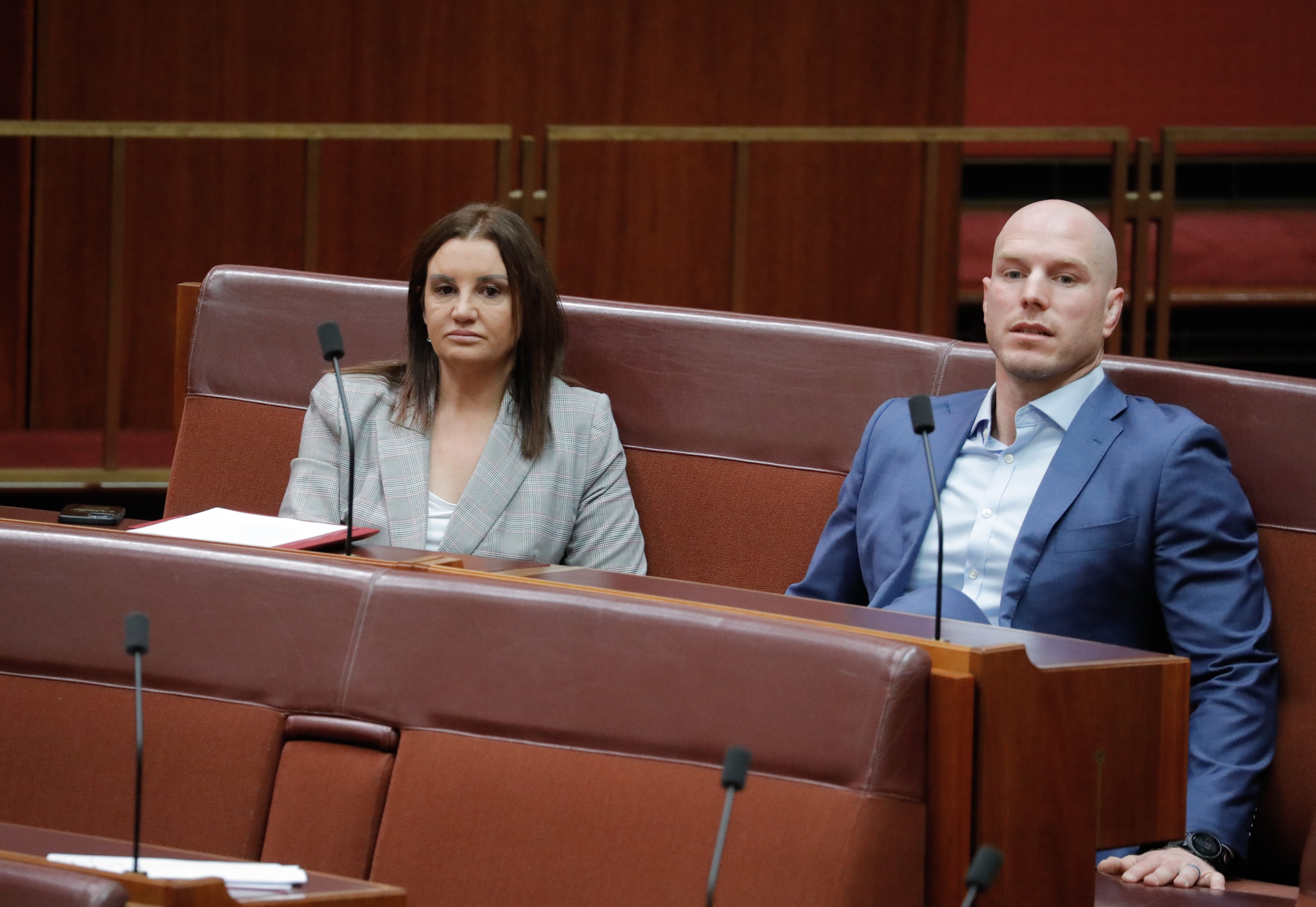 Jacqui Lambie, David Pocock sitting next to each other during Senate Question Time.
