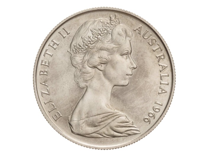 An Australian silver coin from 1966 bearing an effigy of Queen Elizabeth II as a young woman wearing a crown. 