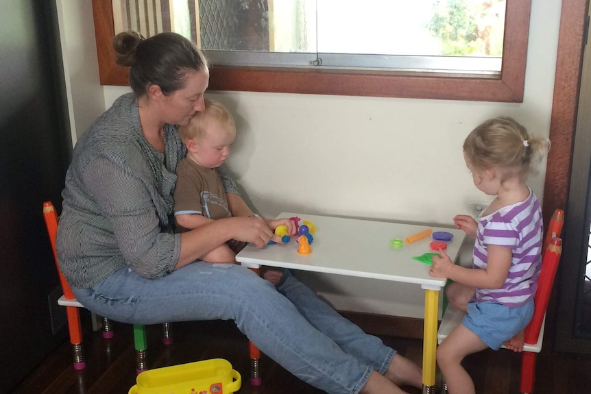 Alyce Tincknell playing with her children