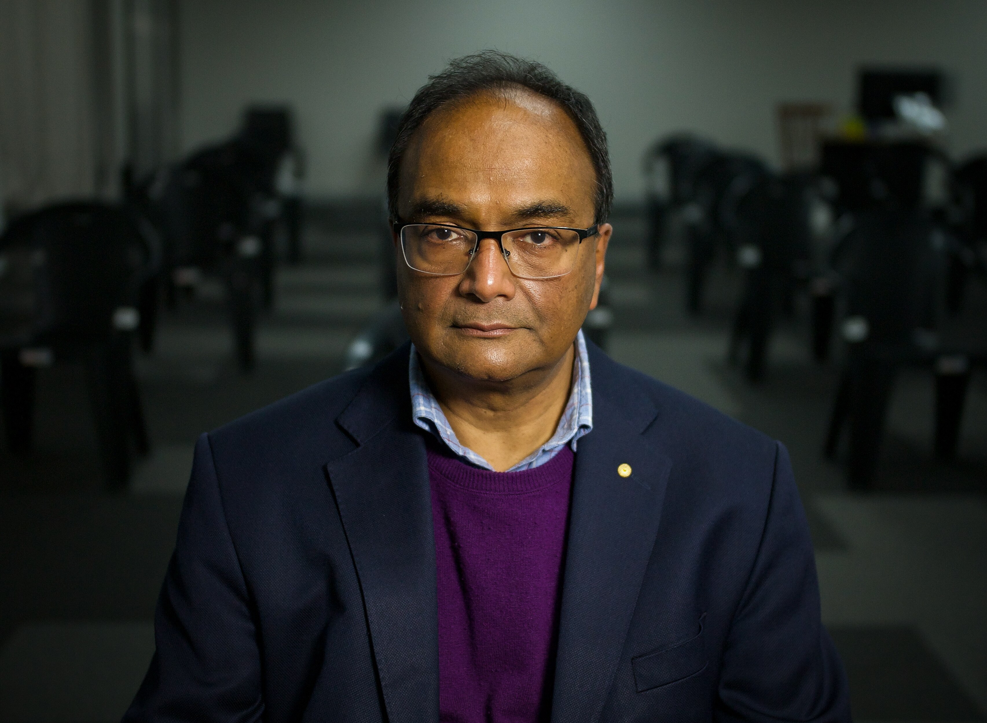 A man looks at the camera.