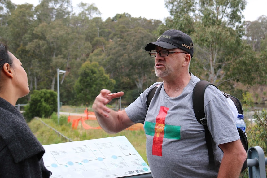 Pete Burns guiding a walking tour of Melbourne.