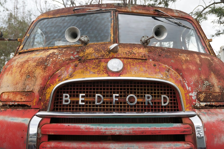 The front of an old truck with the word 'Bedford' across the front.