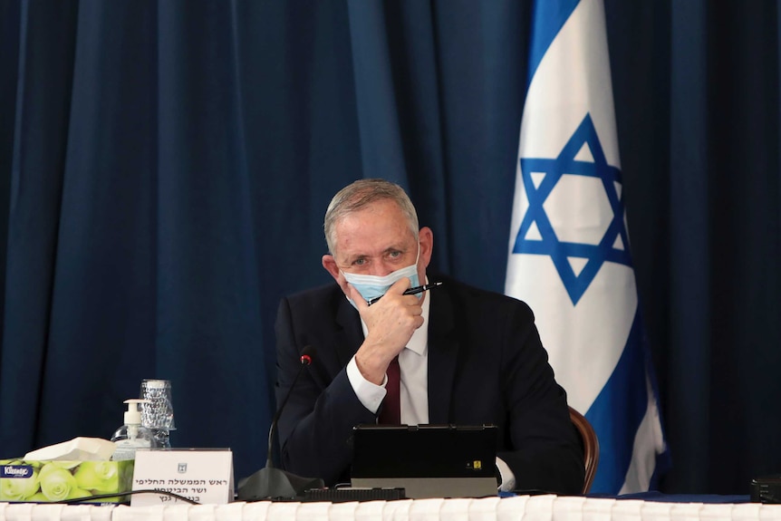 Israeli Minister of Defense and Alternate Prime Minister Benny Gantz wears a protective mask.