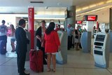 Passengers at Qantas automatic check in. (file)