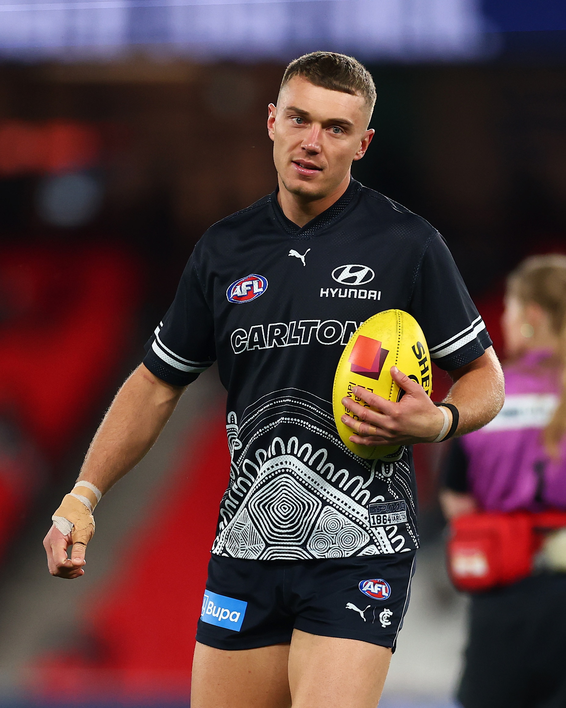 Patrick Cripps warming up for the Blues ahead of an AFL match.
