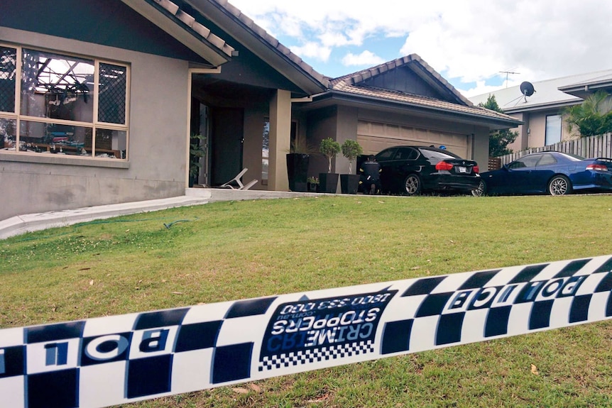 Burnt house with car that allegedly rammed the building at Brookwater