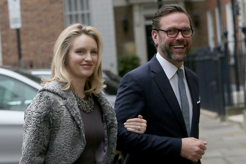 James Murdoch and his wife Kathryn arrive for a wedding reception.