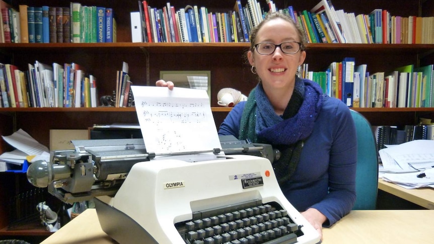 Kristen Gidney with the music typewriter at the National Library of Australia.