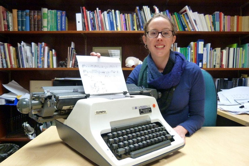 Kristen Gidney with the music typewriter at the National Library of Australia.