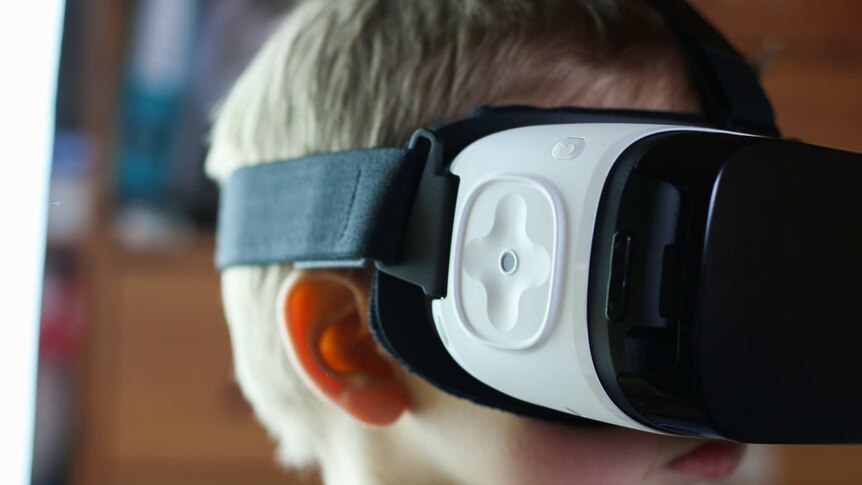 Boy wearing VR goggles