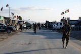 Afghan National Army soldiers stand alert after clashes against security forces at Kandahar Airport
