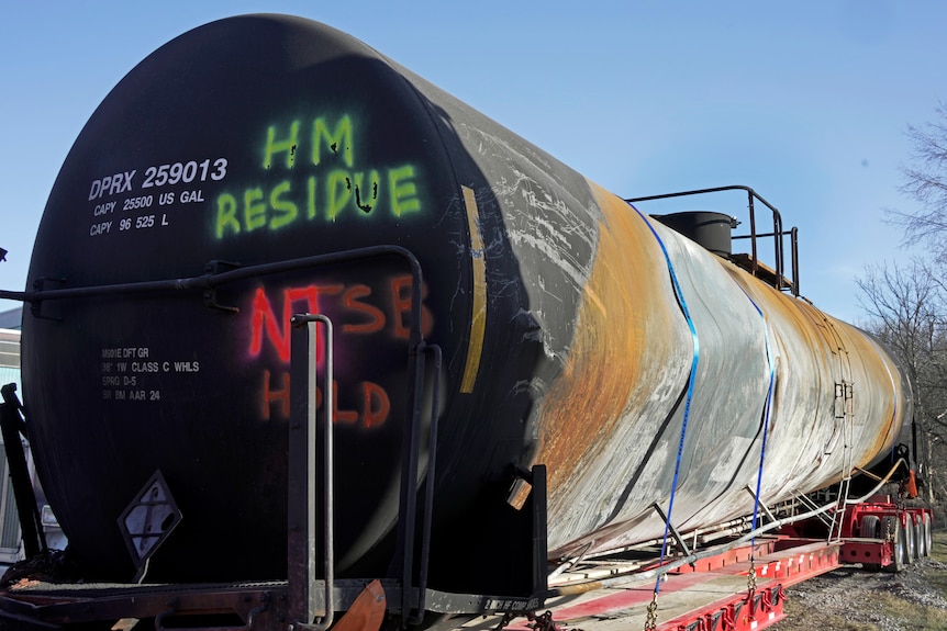 A burnt container is seen at the site where toxic chemicals were spilled.