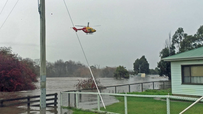 Helicopter searches floodwaters