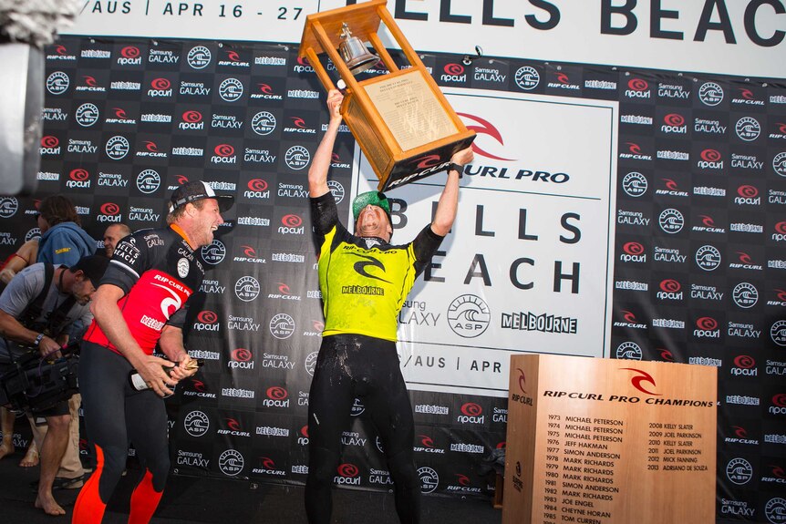 Mick Fanning with the Bells Beach trophy.