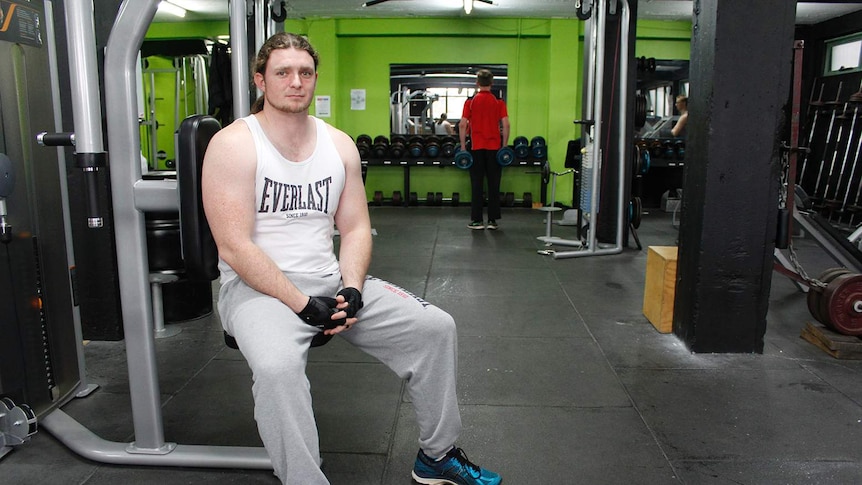 Brian Hunt sitting in the Launceston PCYC gym