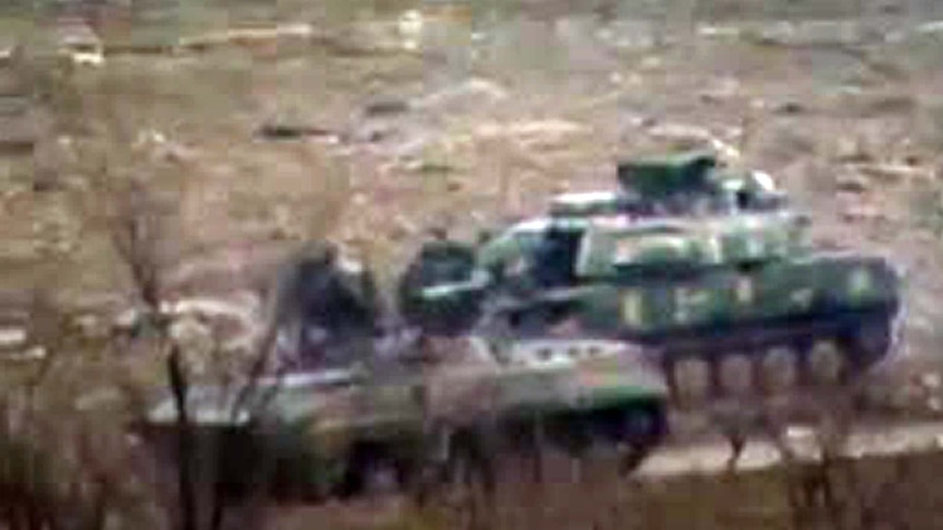 Syrian army tanks outside Zabadani, near the Syrian capital Damascus