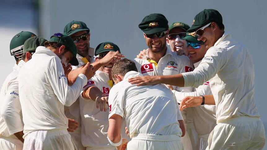 Peter Siddle is surrounded by team-mates