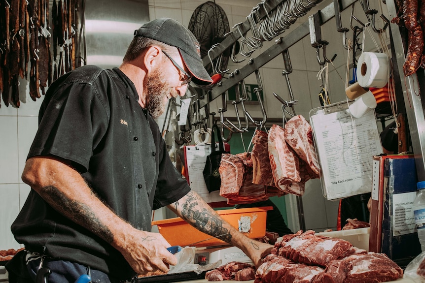 Butcher Steve McKenny prepares slices of beef