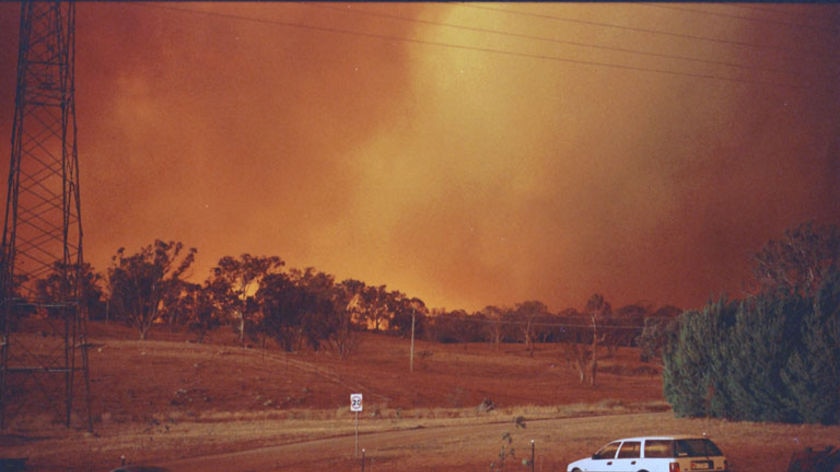 The 21 photos tendered to court capture the approaching firestorm on January 19, 2003.